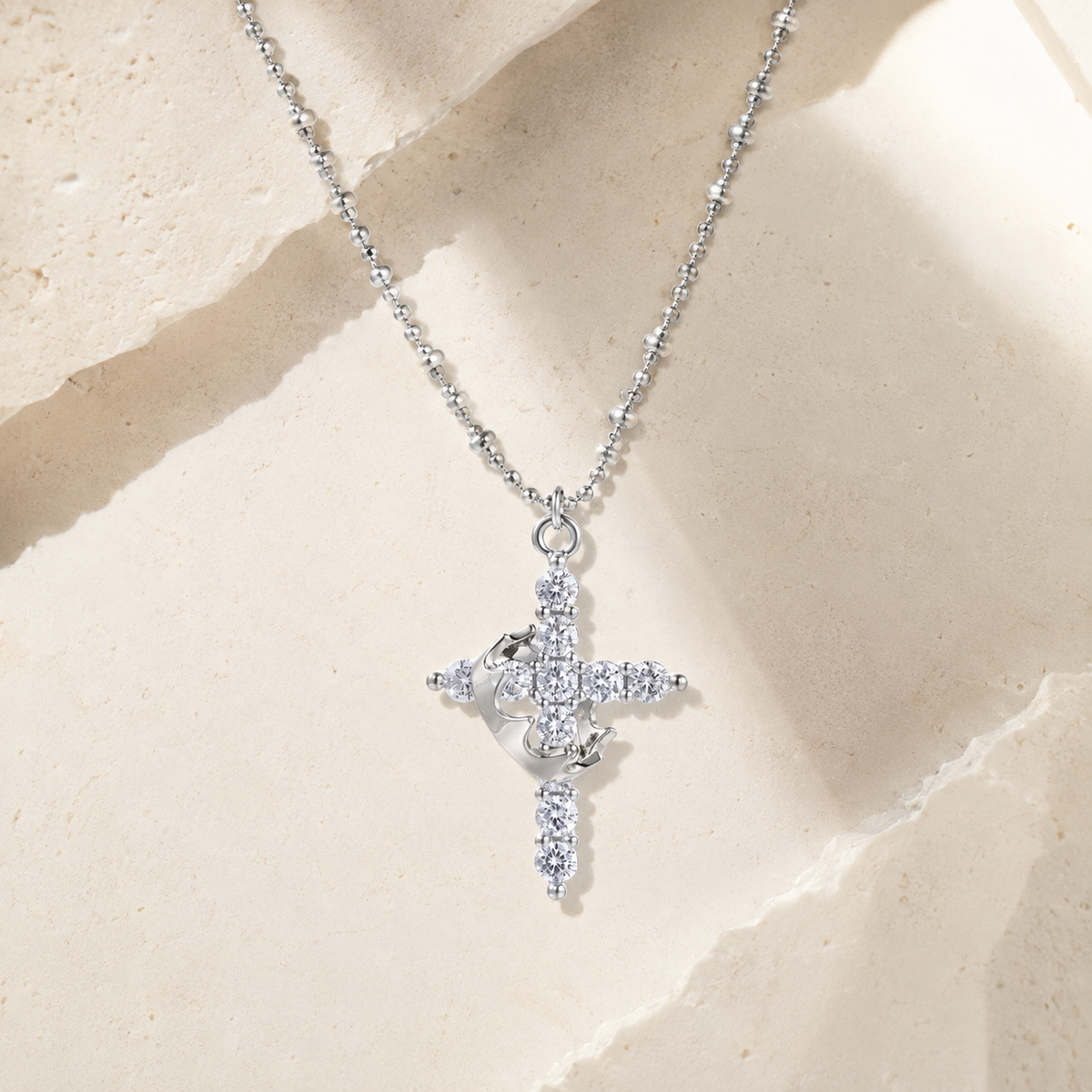 Memory That Lasts Divine Grace silver-tone zirconia cross necklace on warm ivory limestone
