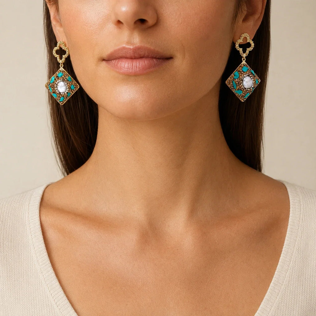 Woman wearing Moroccan Dreams Drop Earrings with turquoise-tone stones, amber crystals, and freshwater pearls