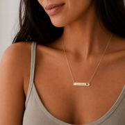 Gold Sagittarius zodiac bar necklace nested in a cream gift box, gift-ready - keep it or give it. Memory That Lasts.