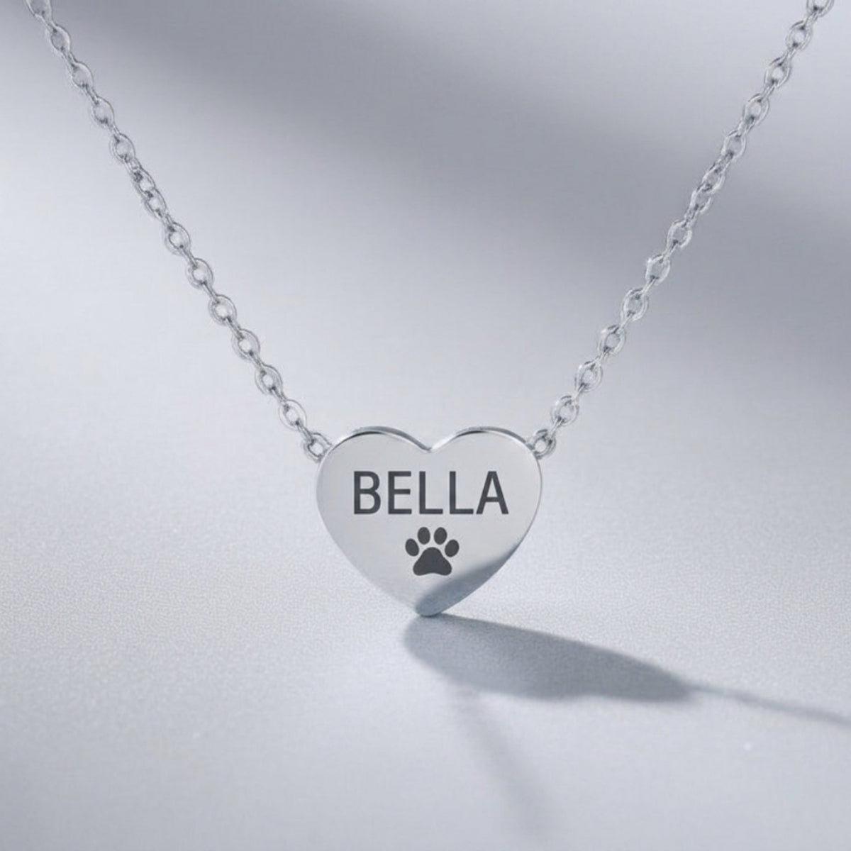 Stainless Steel heart necklace engraved with pet name Bella and paw print